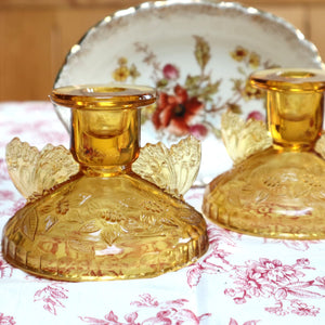 A Pair of Pressed Glass Butterfly Candlesticks